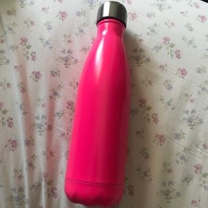 Bright pink Swell water bottle